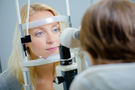 woman being tested for low vision with her optometrist