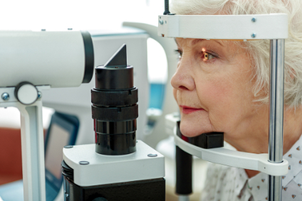 elderly woman getting diabetic retinopathy exam